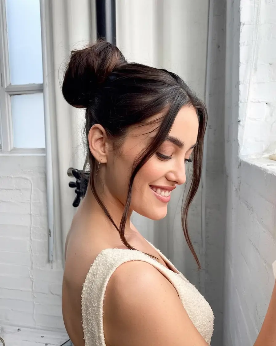 Practical Summer Swimming Hairstyles 2025 Polished Top Knot with Curtain Bangs