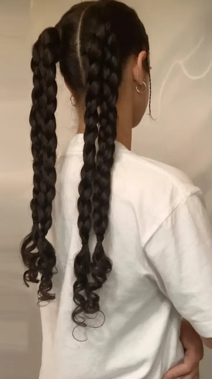 end of summer hairstyles ideas 2025 Twin Braided Ponytails with Curled Ends