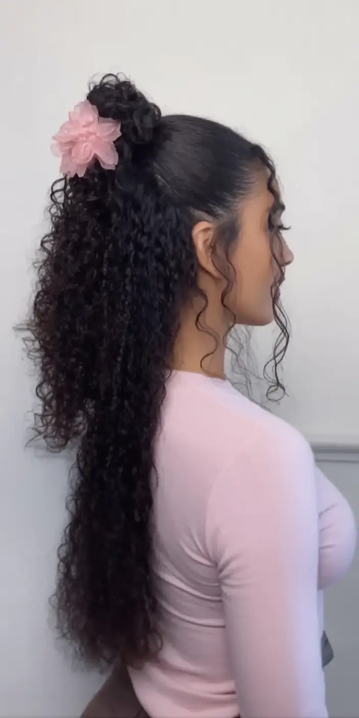 end of summer hairstyles ideas 2025 Half-Up Natural Curls with a Floral Clip