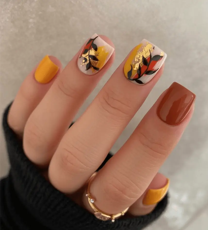 Creative Fall Gel Nail Designs 2025 Abstract Autumn Leaves with Gold Foil