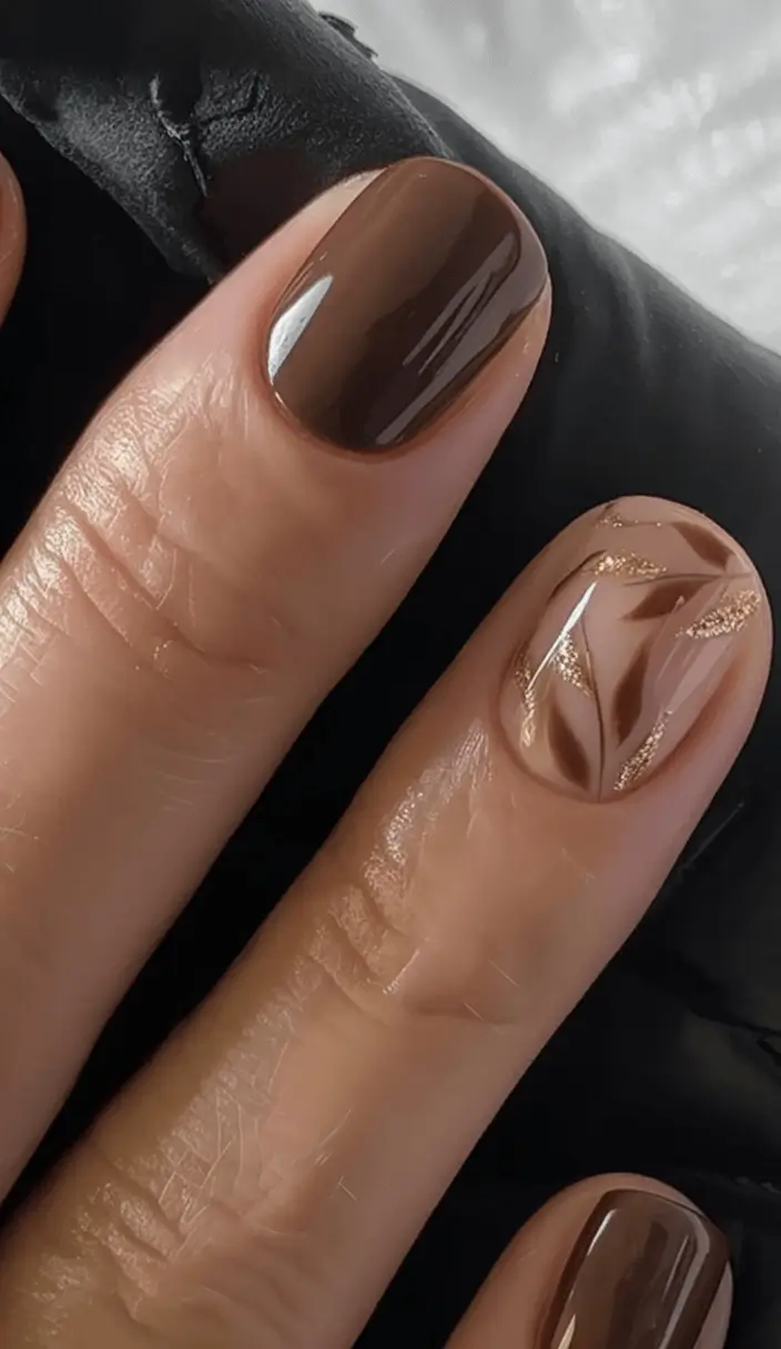 Creative Fall Gel Nail Designs 2025 Brown and Beige Swirl with Touches of Glitter