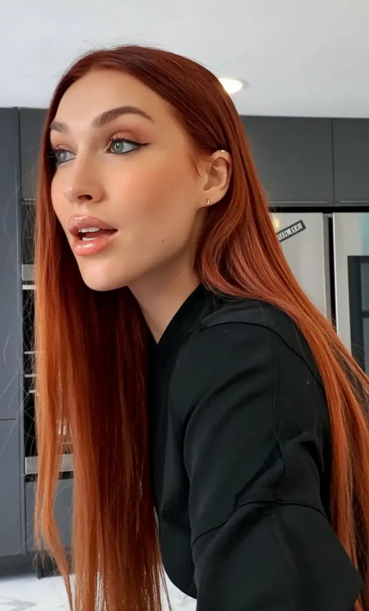 Fall 2025 Hair Colors Ideas for Warm Skin Sleek Red with Muted Copper Glow