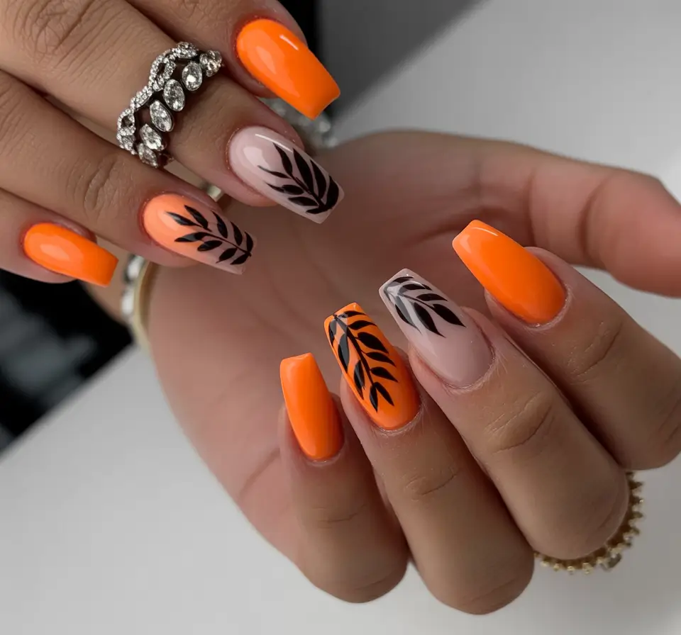 fall nail art ideas for september 2025 Bold Orange Leaves With Nude Contrast