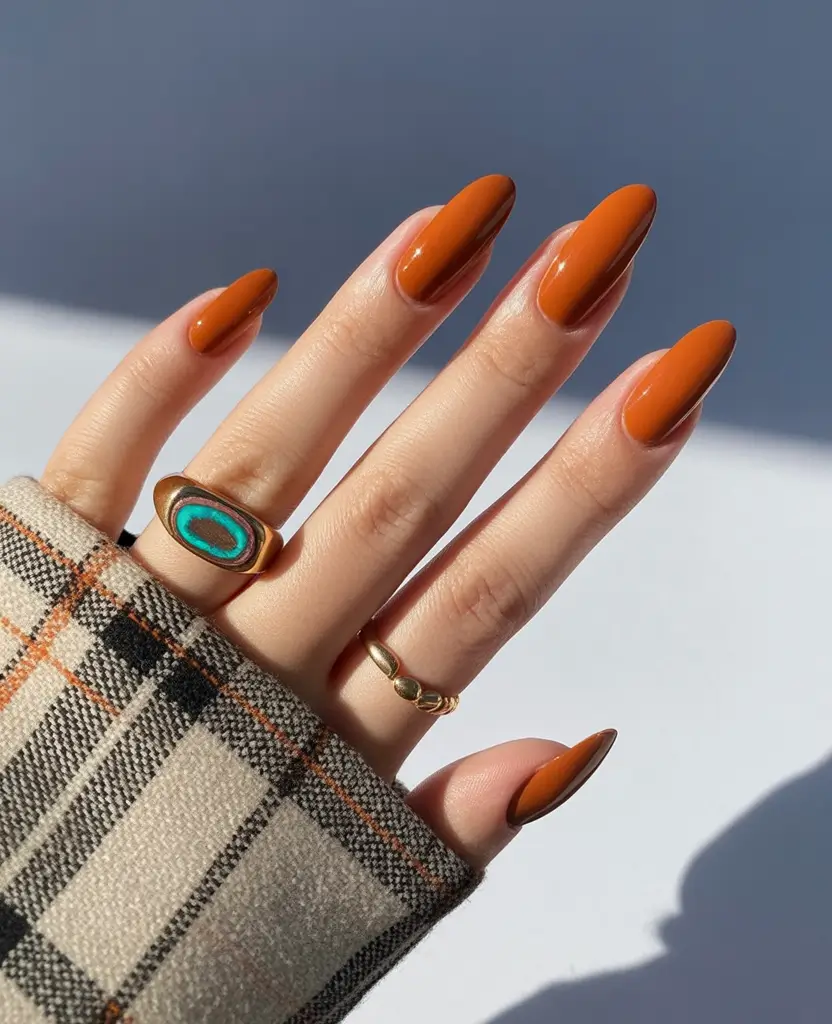 minimalist fall nails 2025 Terracotta Gloss on Oval Nails
