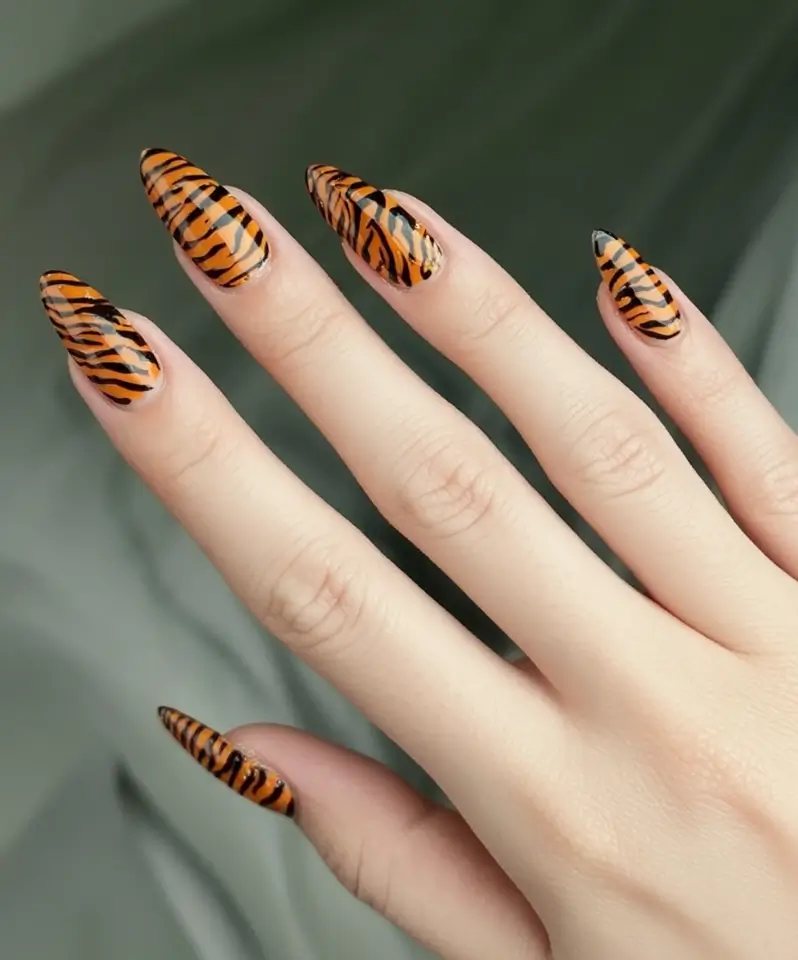 trendy shades of fall nail colors 2025 fierce tiger stripe statement