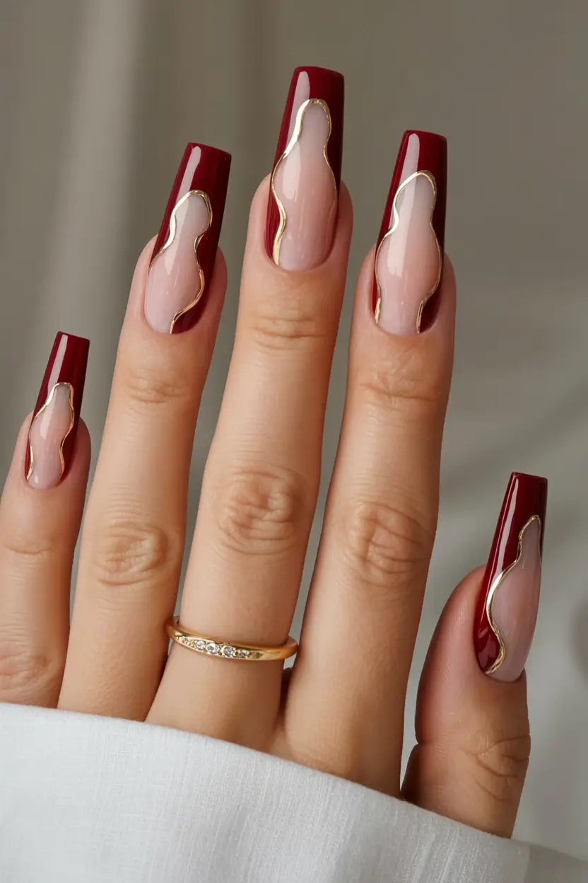 Early Fall Nail Ideas 2025 Glossy Wine Red with Metallic Streamlines