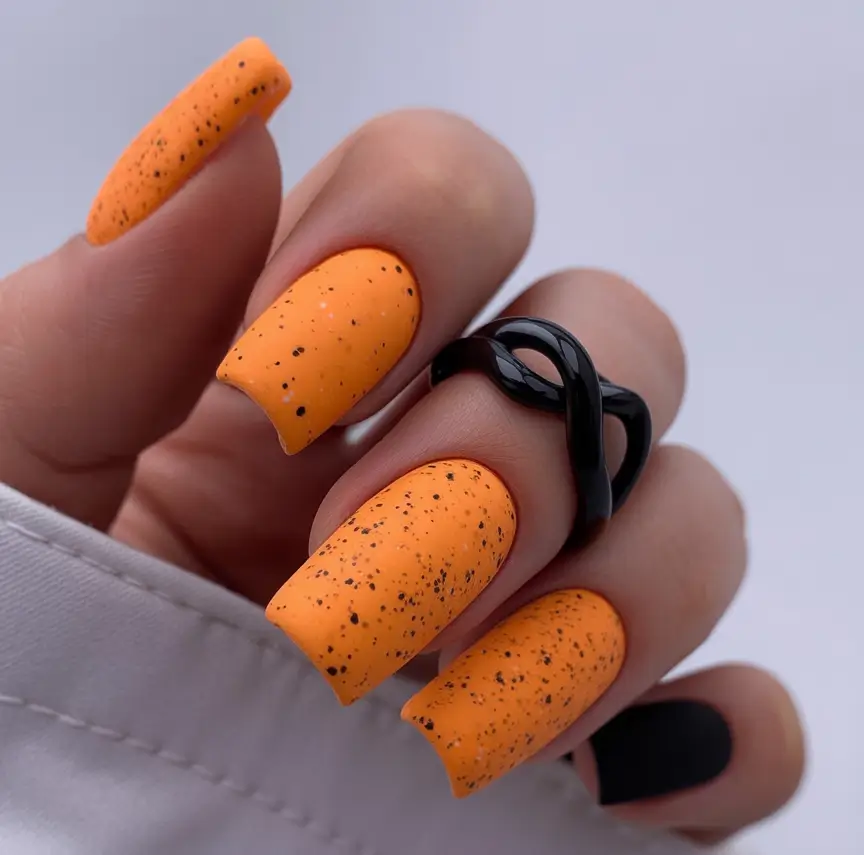 Fall 2025 Nail Color Trend Ideas Black-Orange Micro-Speckled Matte for Edgy Autumn Vibes