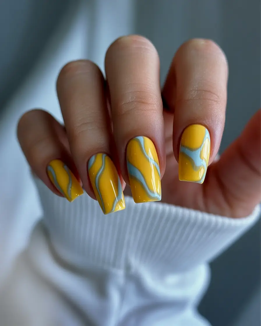 Fall Nail Colors for Medium Skin 2025 – Top Picks Yellow and Blue Wave Design
