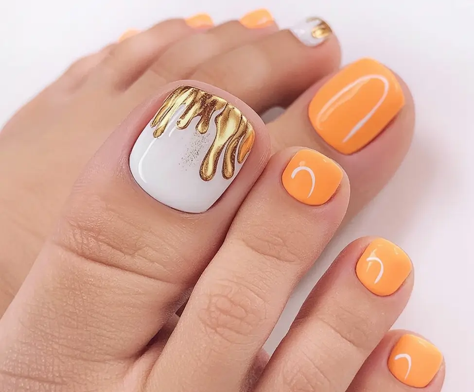 fall pedicure colors 2025 Golden Drip on Soft Orange