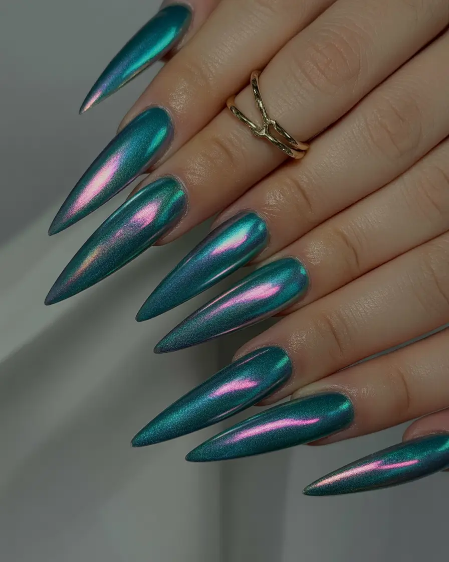 Fall Stiletto Nail Designs 2025 shimmering teal with iridescent glow