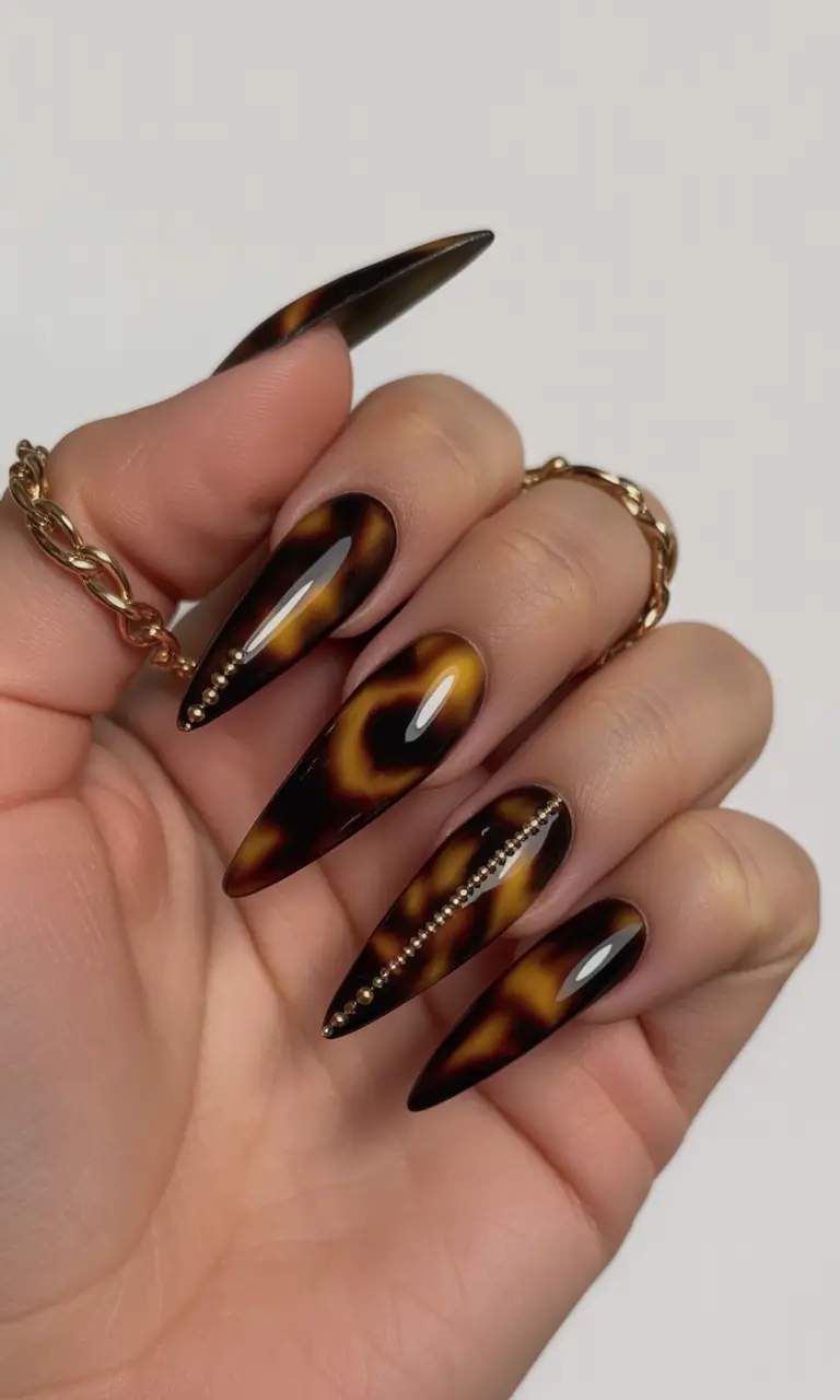 Fall Stiletto Nail Designs 2025 tortoiseshell elegance with golden beads
