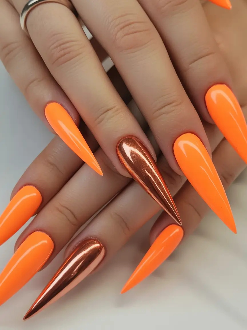 Fall Stiletto Nail Designs 2025 neon orange with metallic copper accent