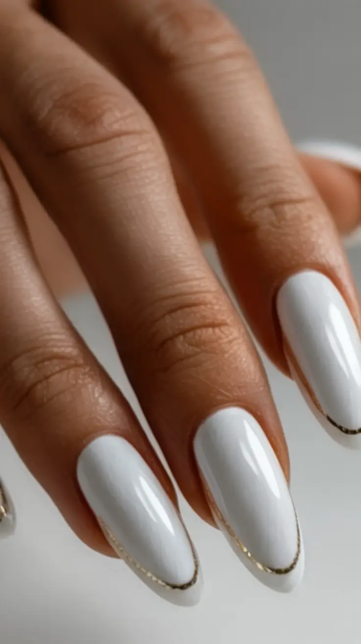 fall wedding nails 2025 White Almonds with Gold Halo Edge