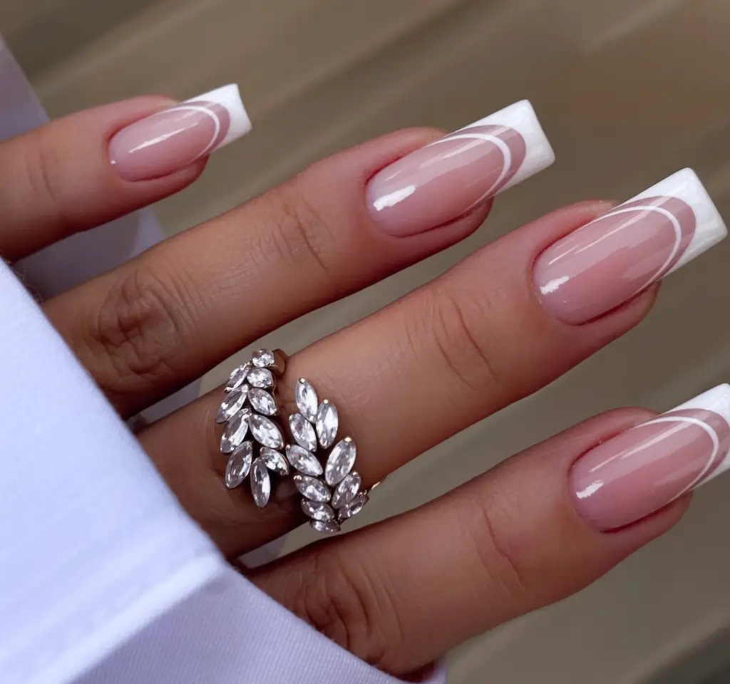 fall wedding nails 2025 Modern French with Swirling Tips