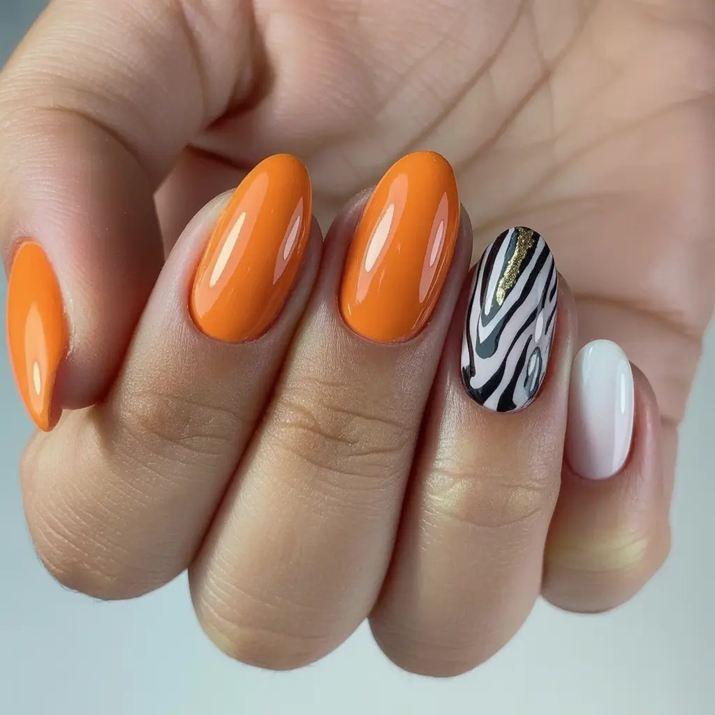 Modern Fall Manicure Ideas 2025 Orange Glow with Zebra Accent