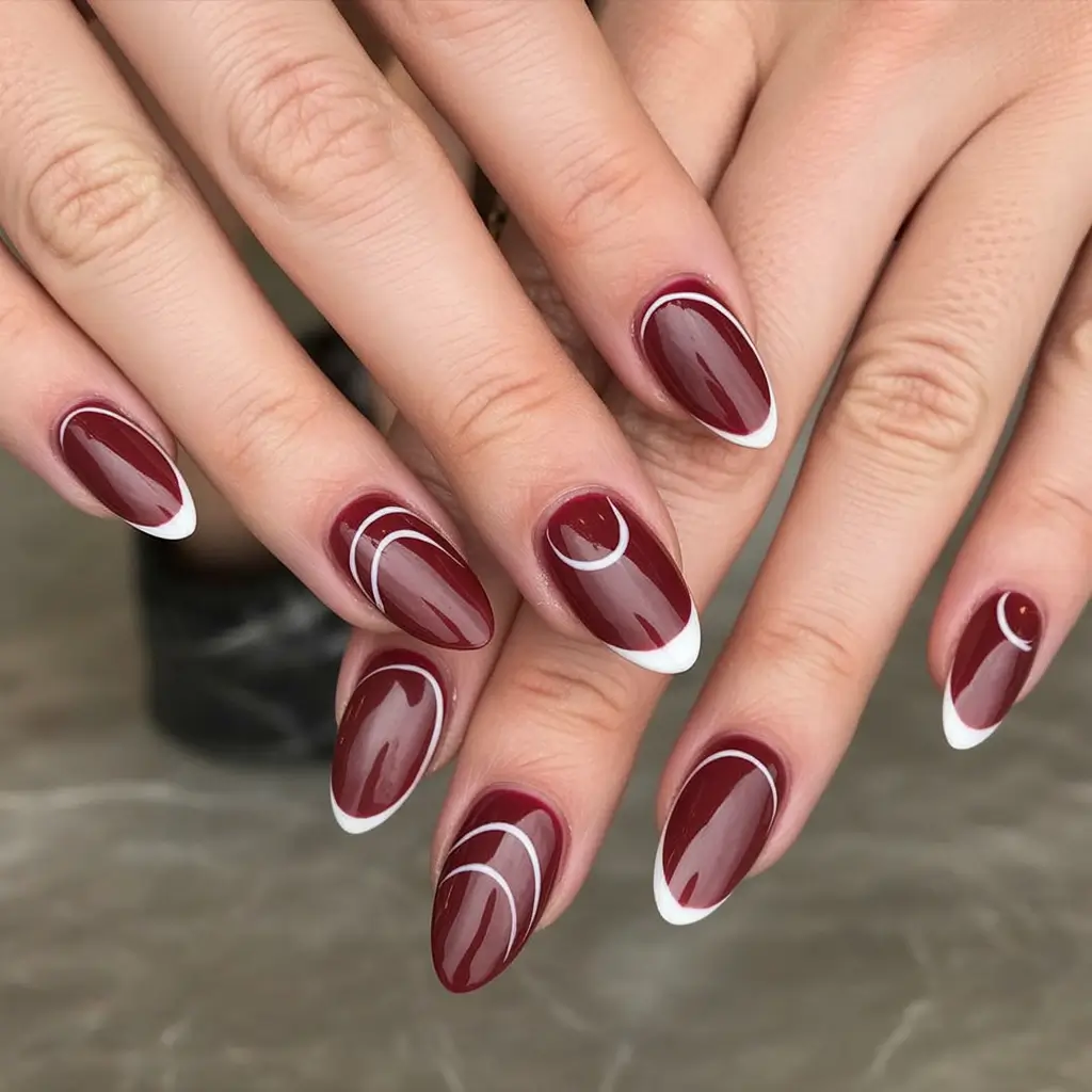Stylish Fall Oval Shape Nail Designs 2025 Deep Red with Modern French Lines