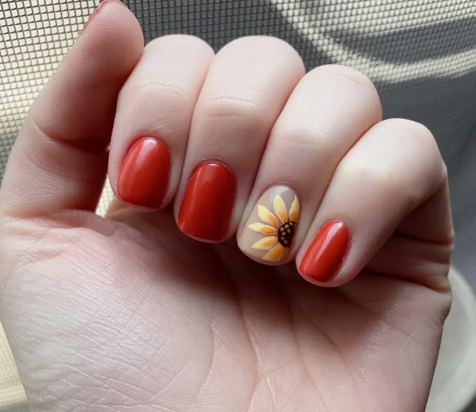 Top Short Fall Nail Trends 2025 Burnt Orange with Minimalist Sunflower Accent