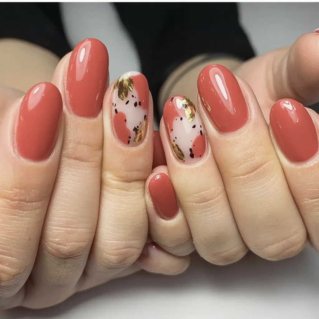 Top Short Fall Nail Trends 2025 Glossy Terracotta with Gold Ink & Abstract Touches