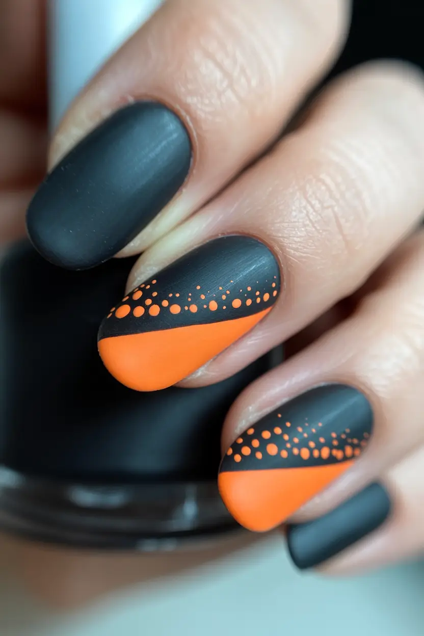 Black nails inspiration 2026 Matte Black with Orange Graphic Accent